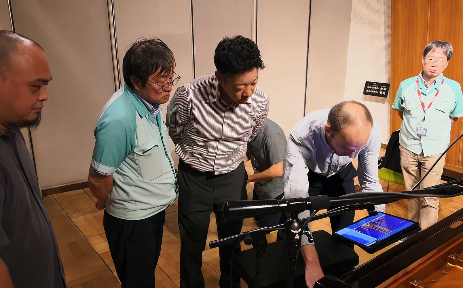 Kawai and Modartt staff analysing the tonal characteristics of the SK-EX