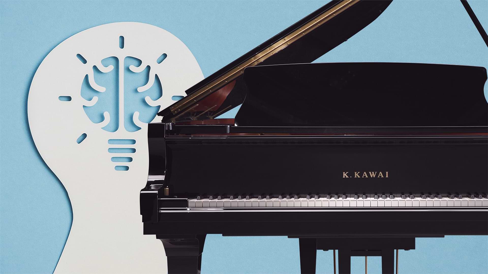 A Kawai grand piano and a light bulb