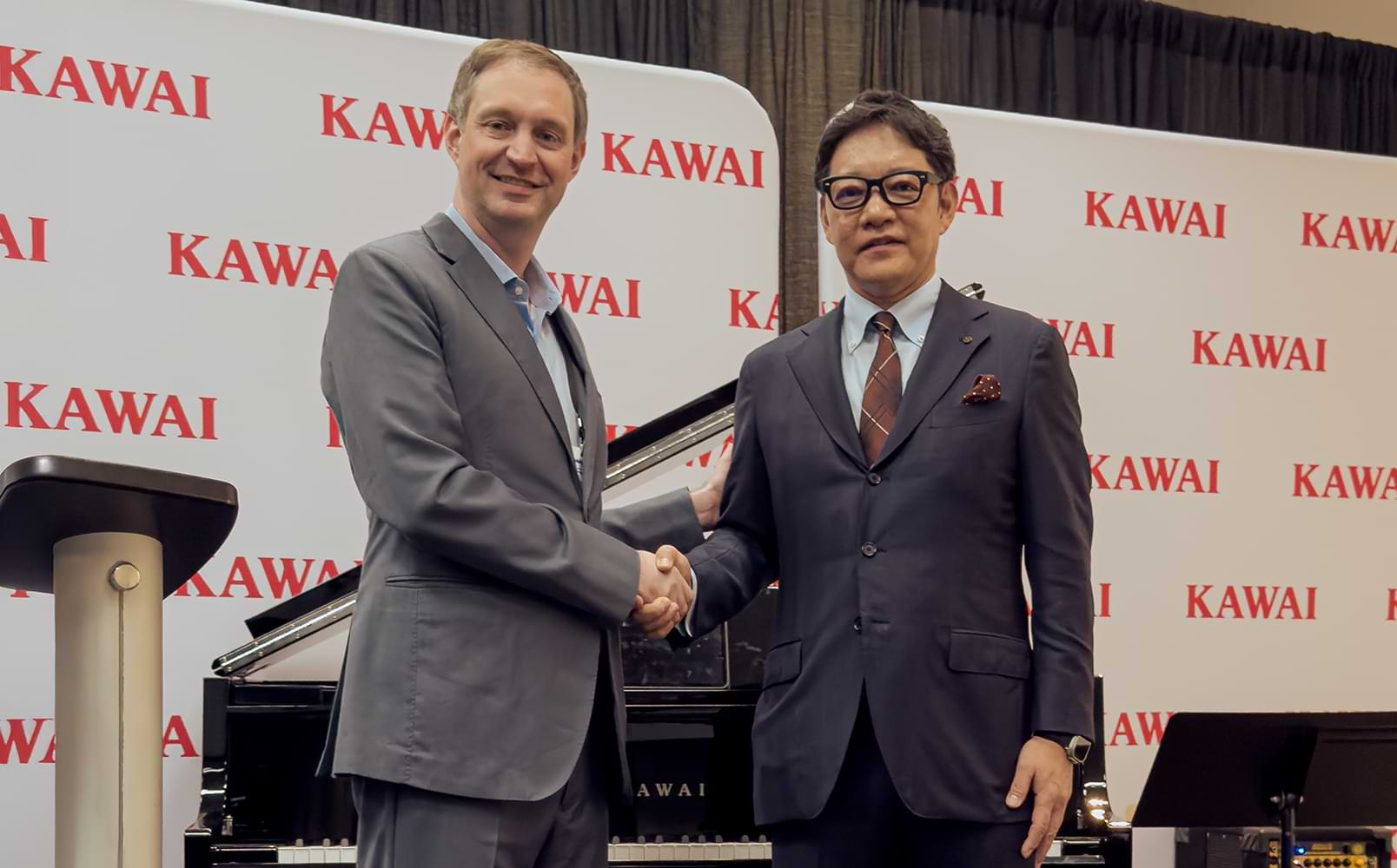 Roland Lamb, Co-founder & CEO of ROLI shaking hands with Kentaro Kawai, President, Kawai Musical Inst. Mfg. Co., Ltd.